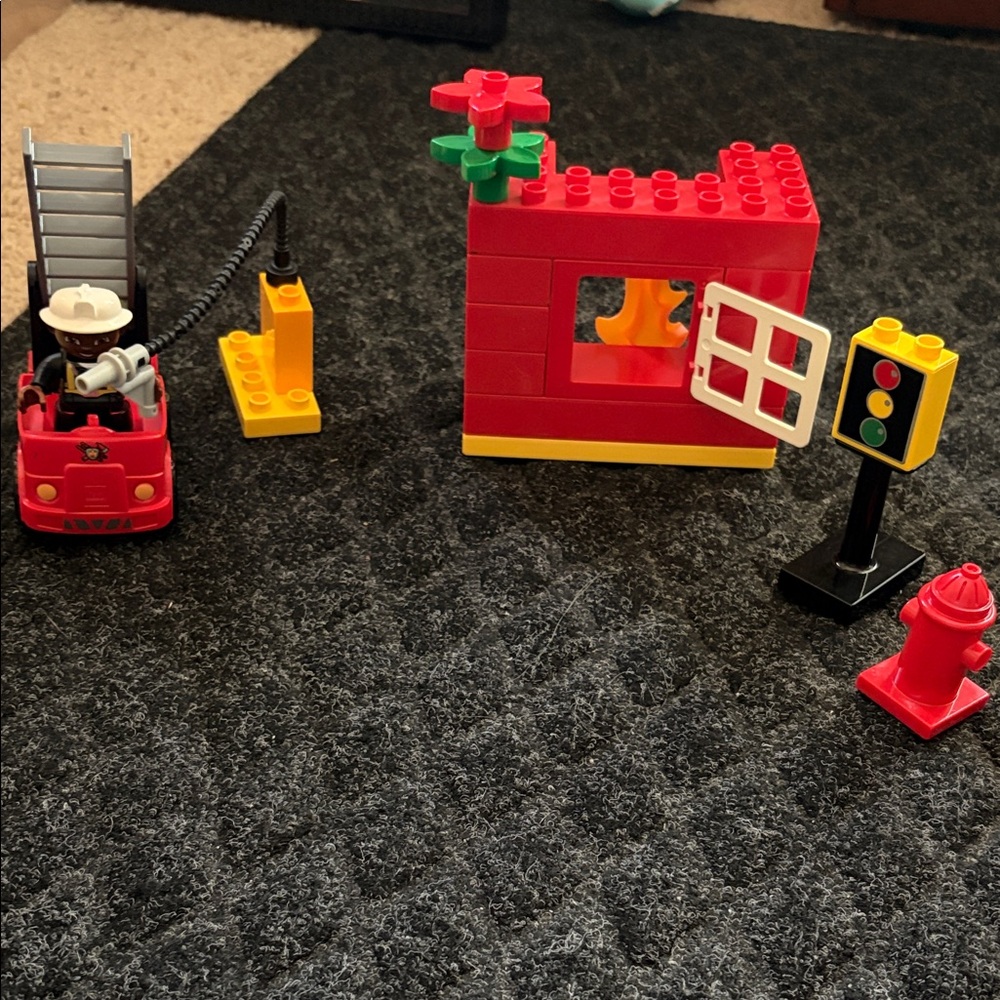Lego Duplo Fire Truck With Firefighter Figure with fire hydrant and flame pieces
